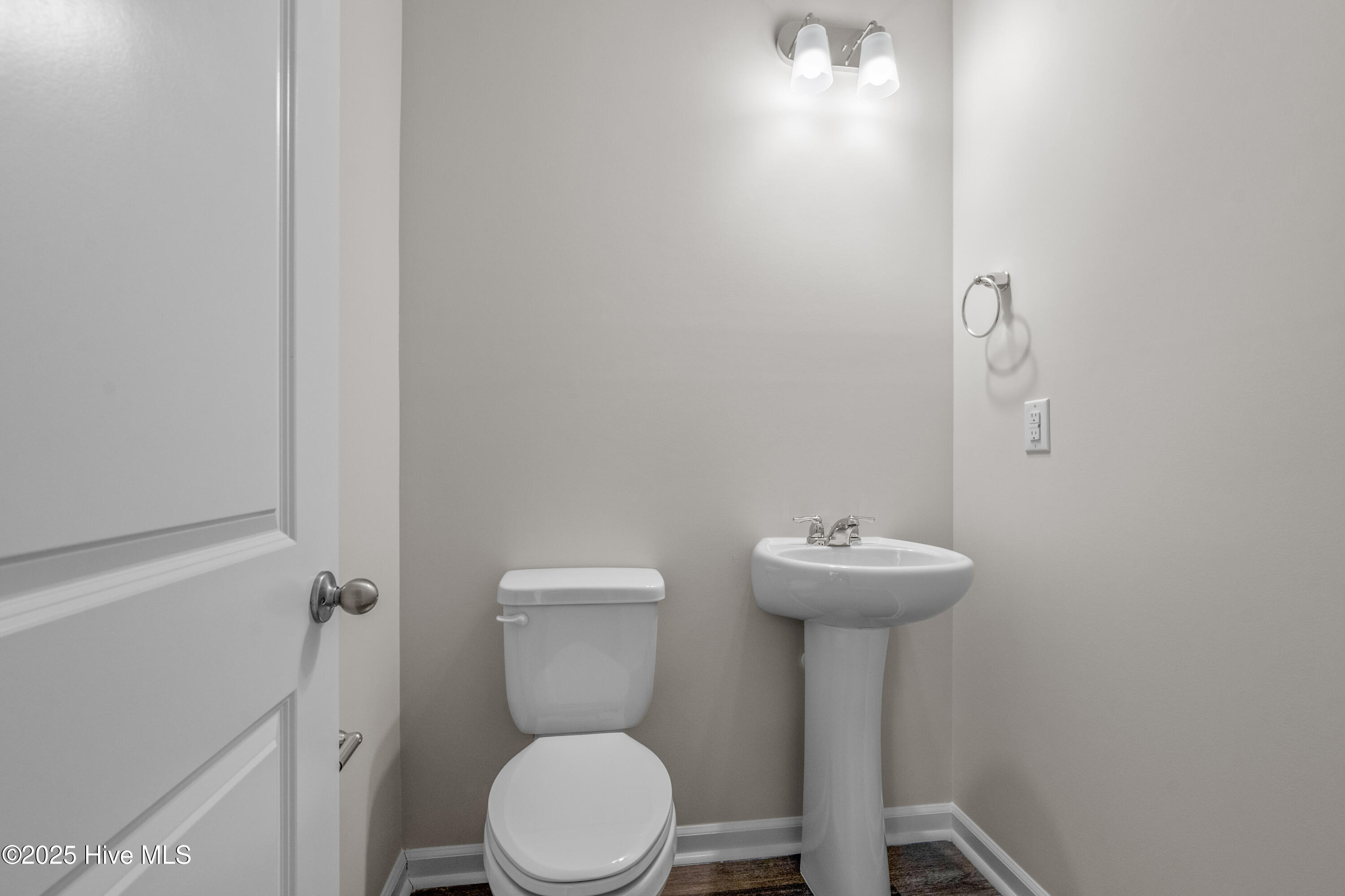 826 Palm Frond Way Calabash, NC 28467 - Photo 25 of 35 Powder room on main level by sliding doors in the rear of the home.