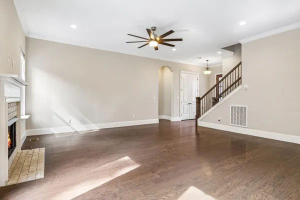 a view of an entryway with wooden floor