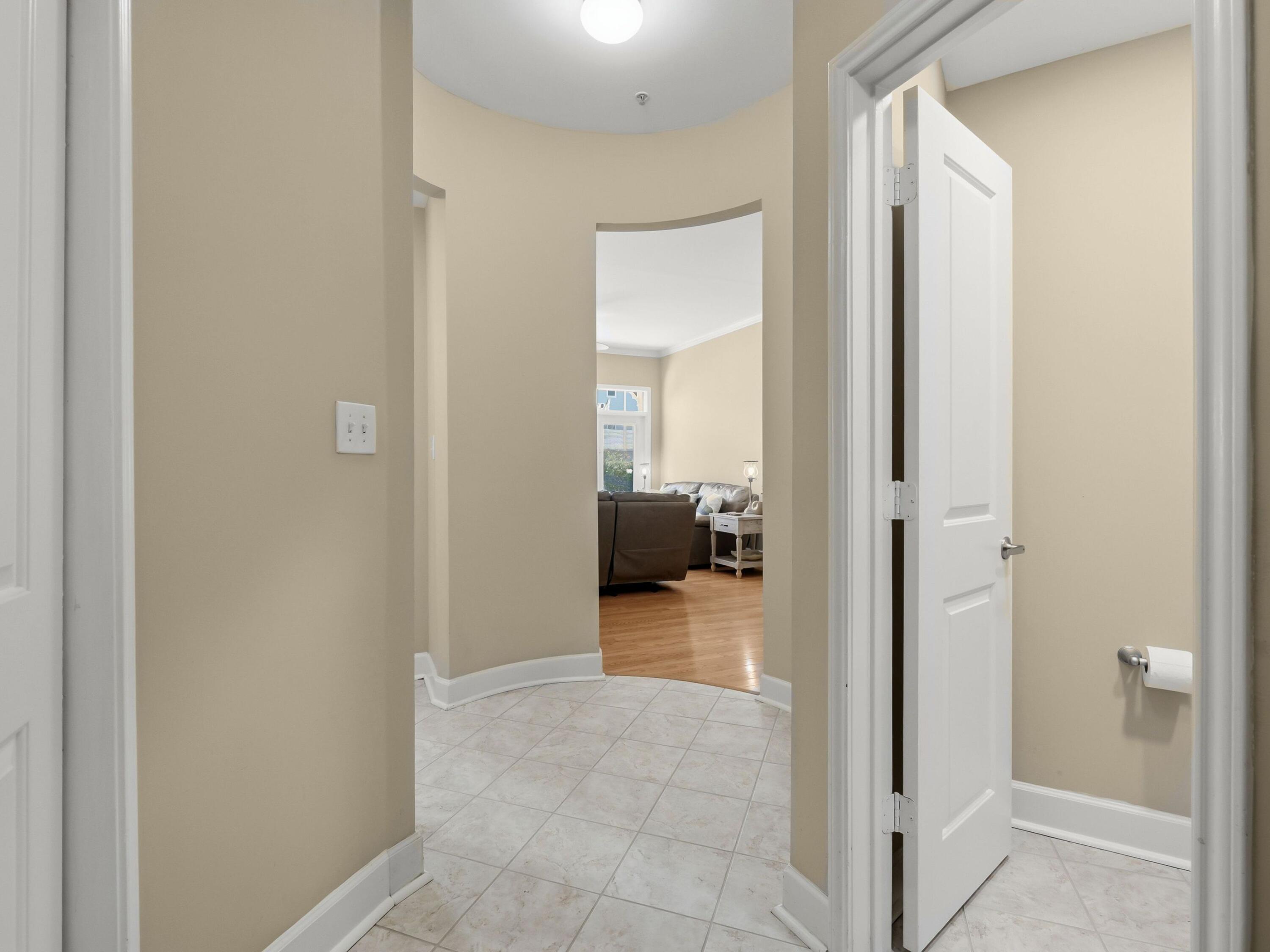 8700 Front Beach Road, Unit 7107 Panama City Beach, FL 32407 - Photo 12 of 54 a view of a hallway with a livingroom and a bathroom