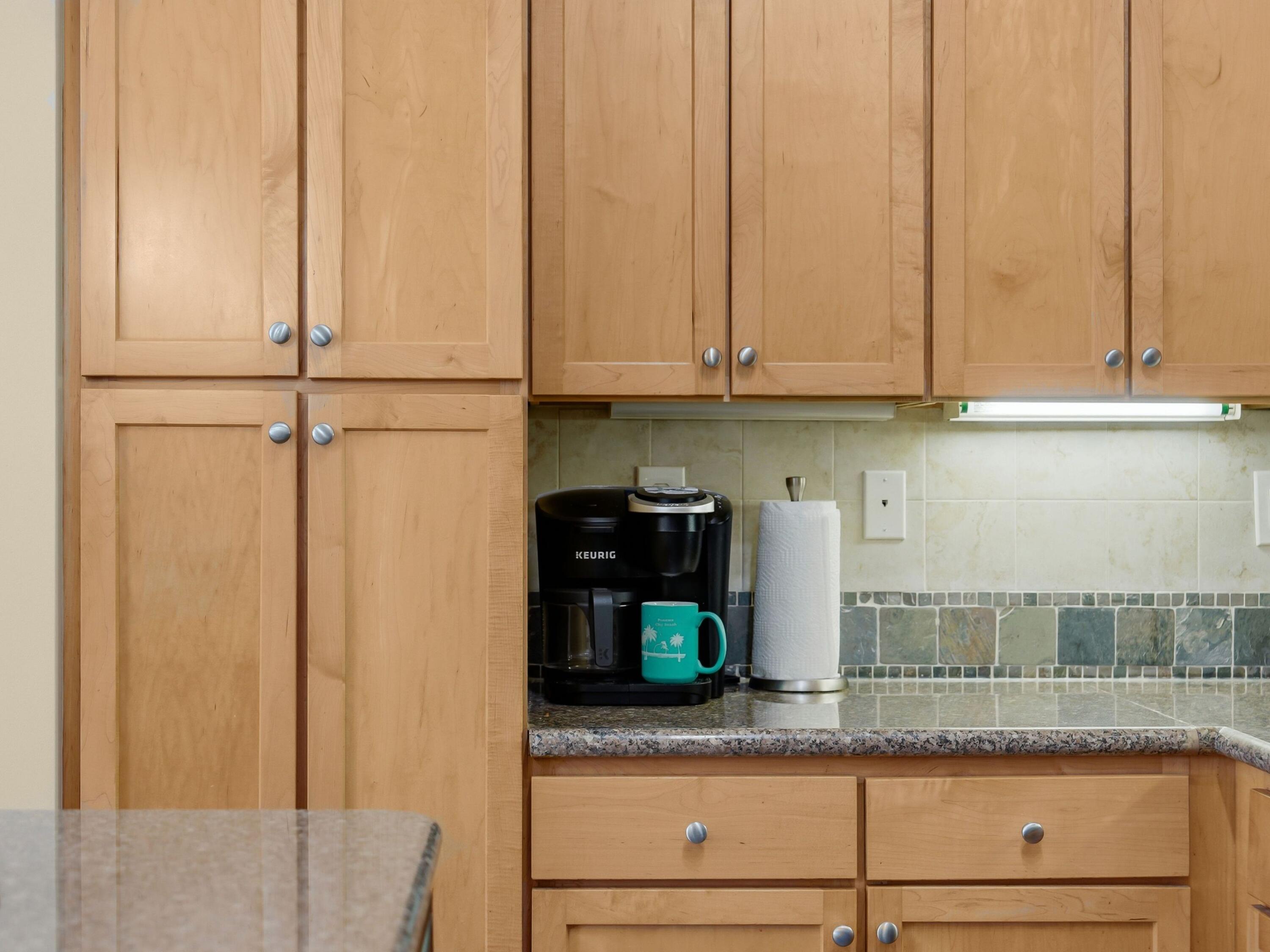 8700 Front Beach Road, Unit 7107 Panama City Beach, FL 32407 - Photo 17 of 54 a kitchen with a refrigerator and cabinets