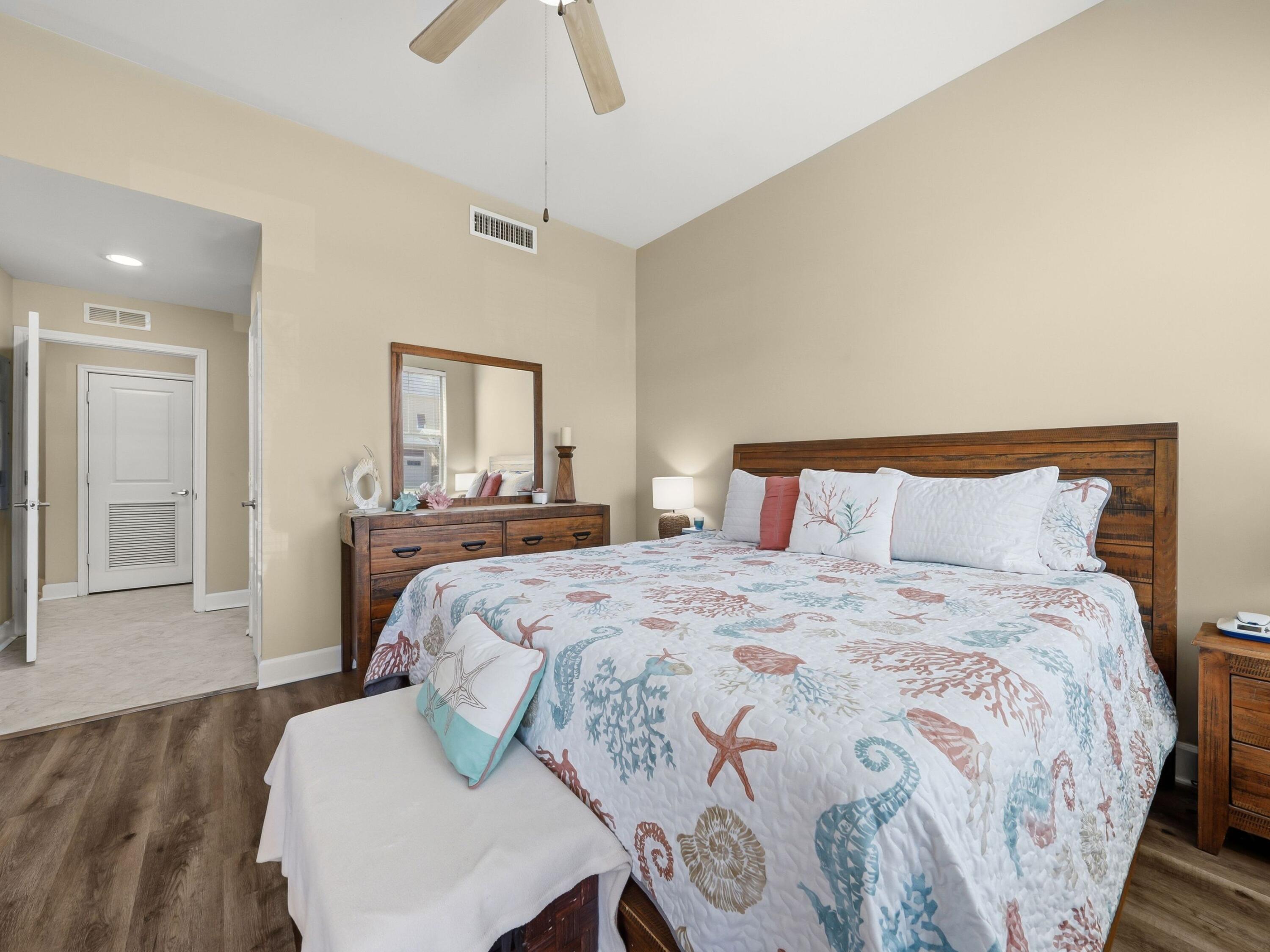 8700 Front Beach Road, Unit 7107 Panama City Beach, FL 32407 - Photo 29 of 54 a bedroom with a bed and window