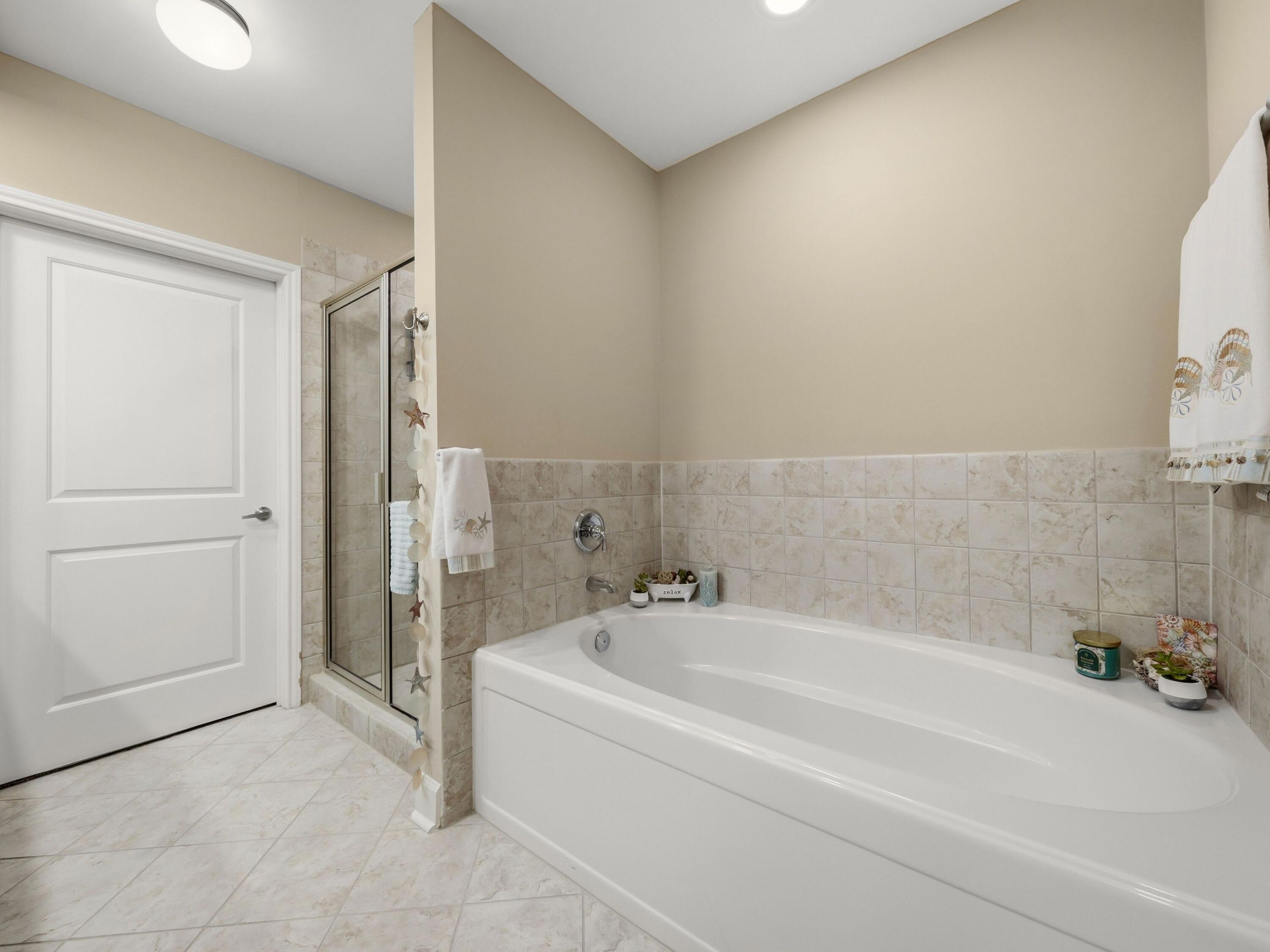 8700 Front Beach Road, Unit 7107 Panama City Beach, FL 32407 - Photo 33 of 54 a bathroom with a bathtub and a shower