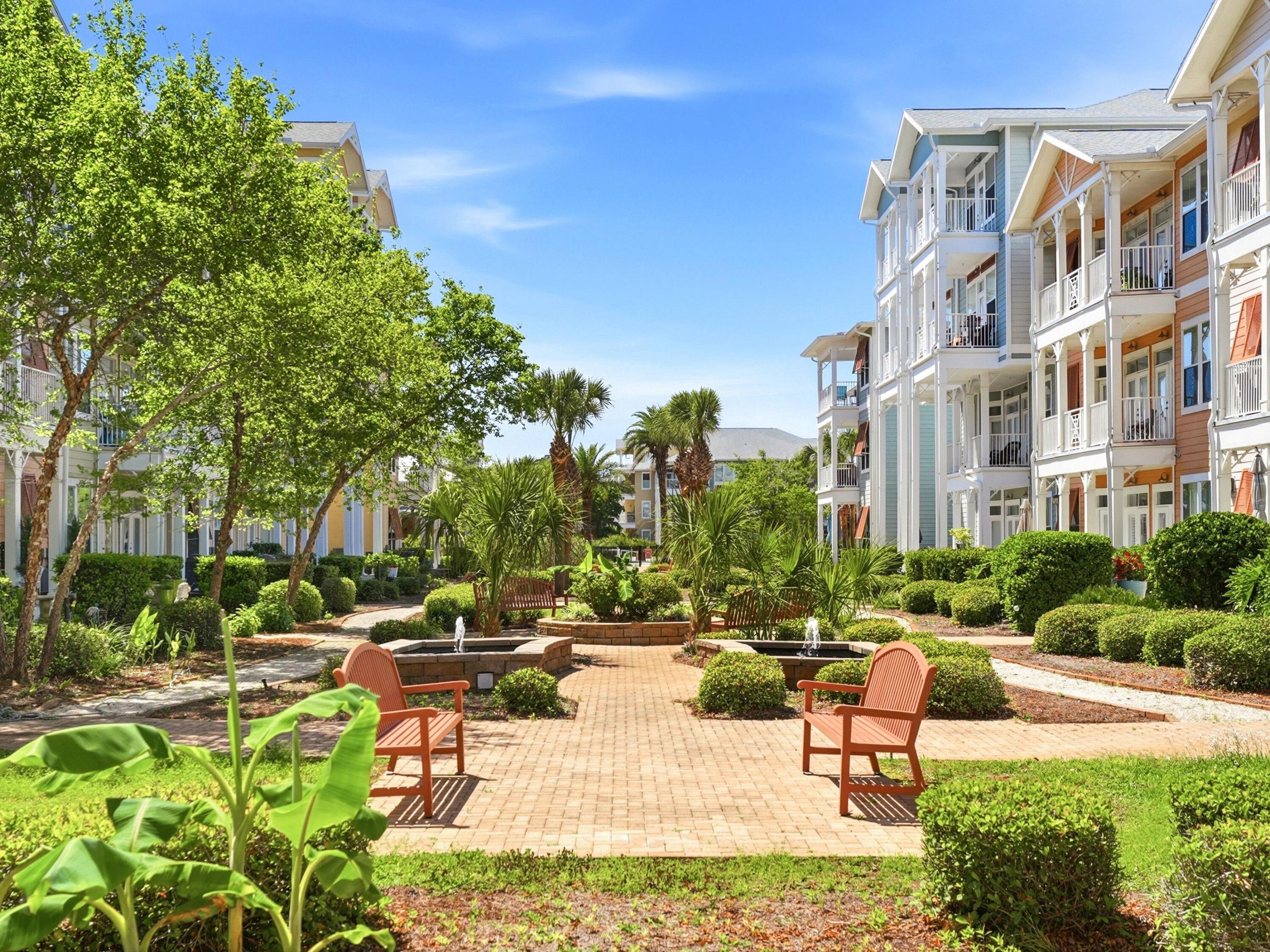 8700 Front Beach Road, Unit 7107 Panama City Beach, FL 32407 - Photo 37 of 54 a view of a building with garden and sitting area