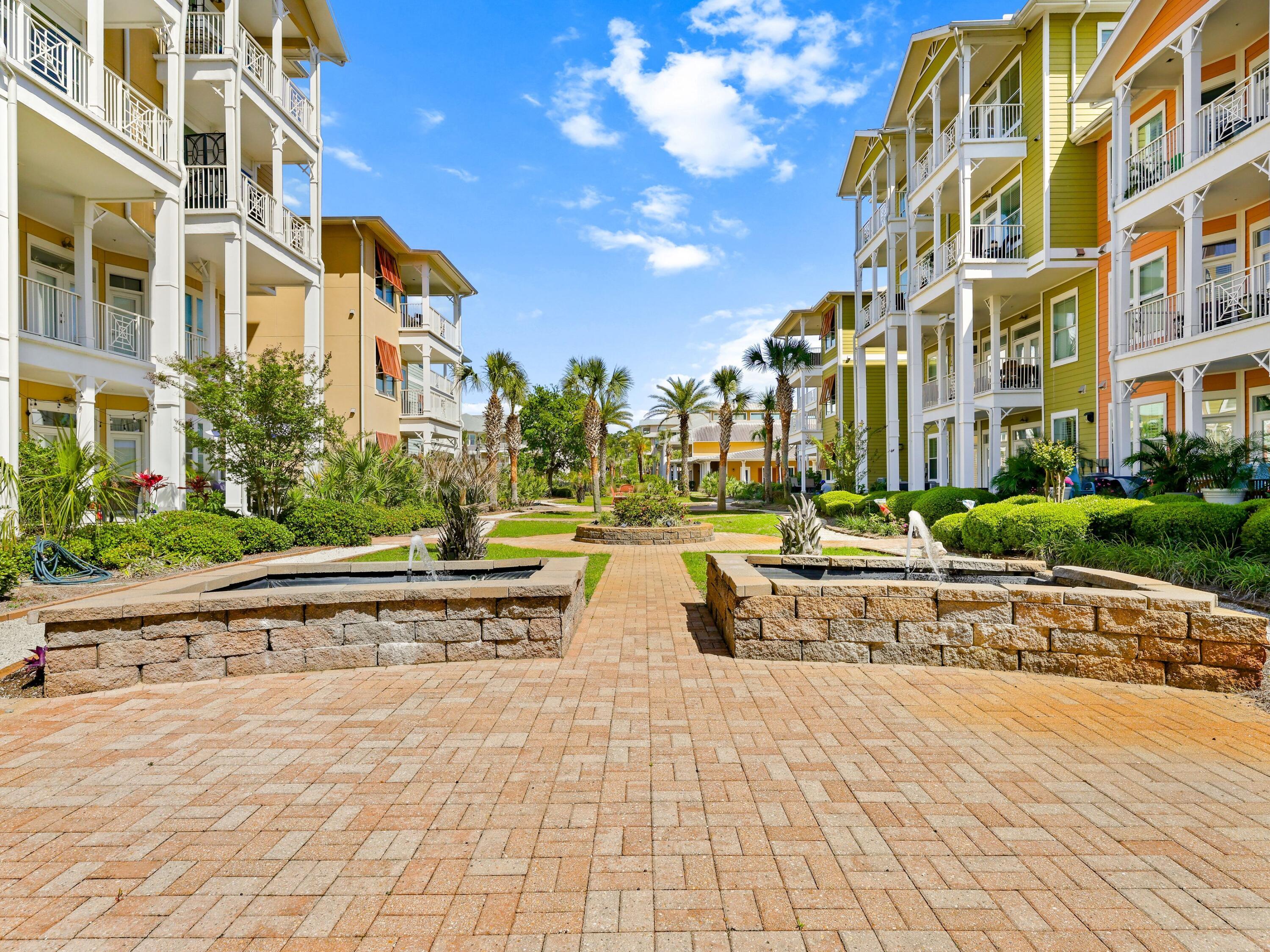 8700 Front Beach Road, Unit 7107 Panama City Beach, FL 32407 - Photo 38 of 54 a view of a building with garden and sitting area