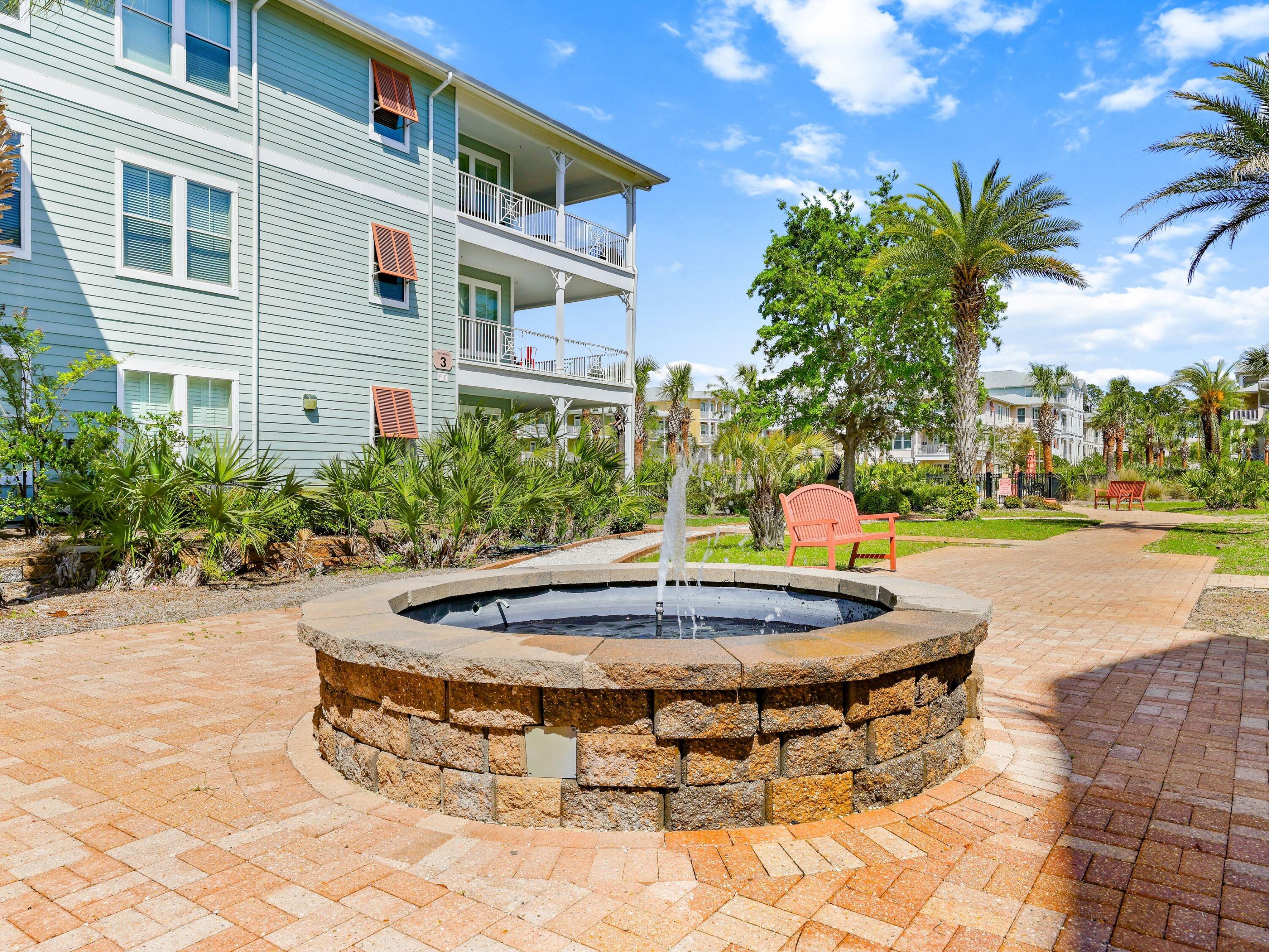 8700 Front Beach Road, Unit 7107 Panama City Beach, FL 32407 - Photo 39 of 54 a view of a playground with basketball court
