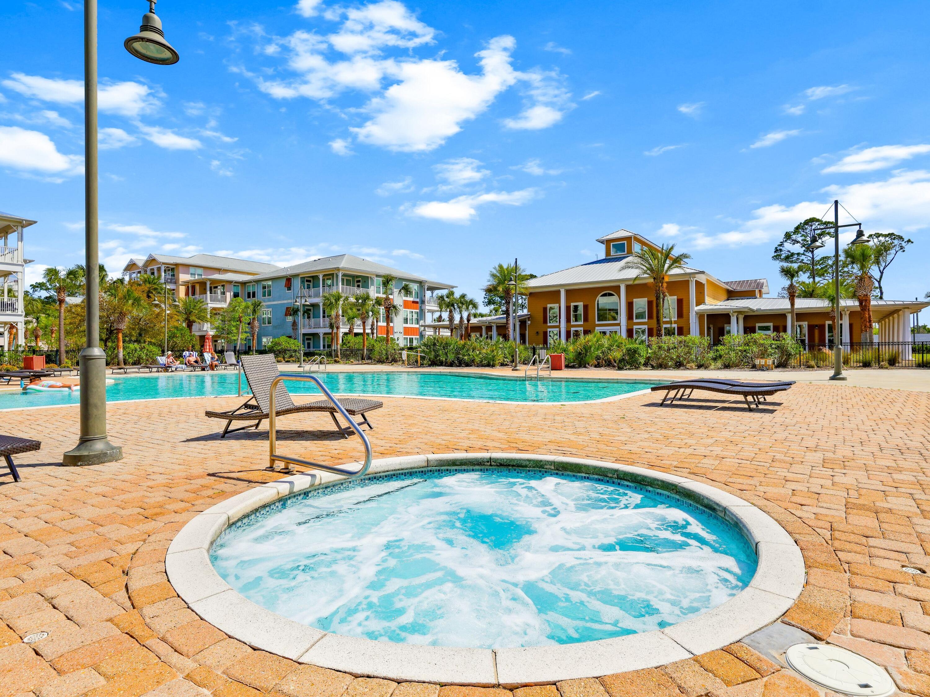 8700 Front Beach Road, Unit 7107 Panama City Beach, FL 32407 - Photo 46 of 54 a view of a swimming pool with a patio