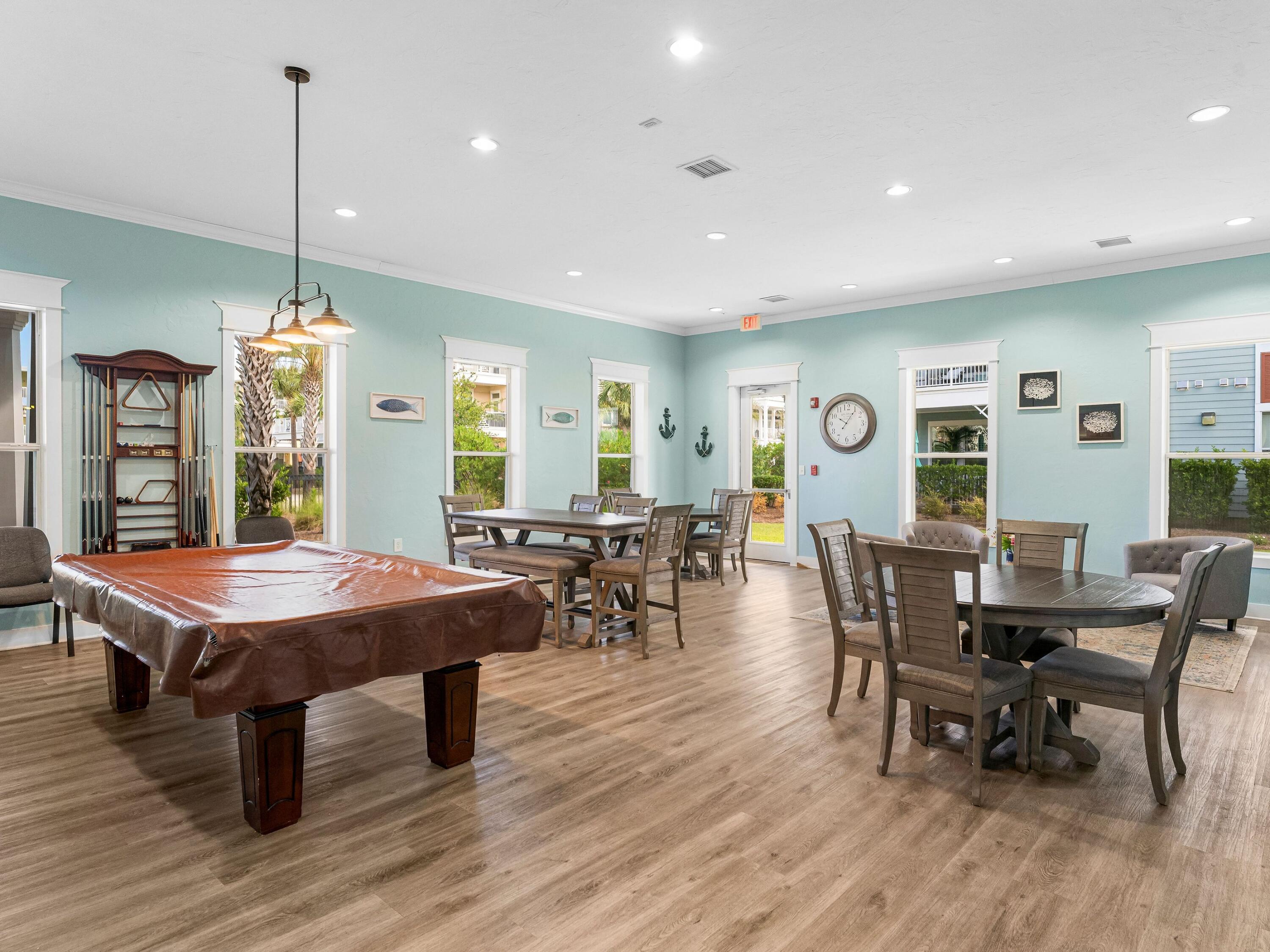 8700 Front Beach Road, Unit 7107 Panama City Beach, FL 32407 - Photo 51 of 54 a dining table tennis with a lots of chairs