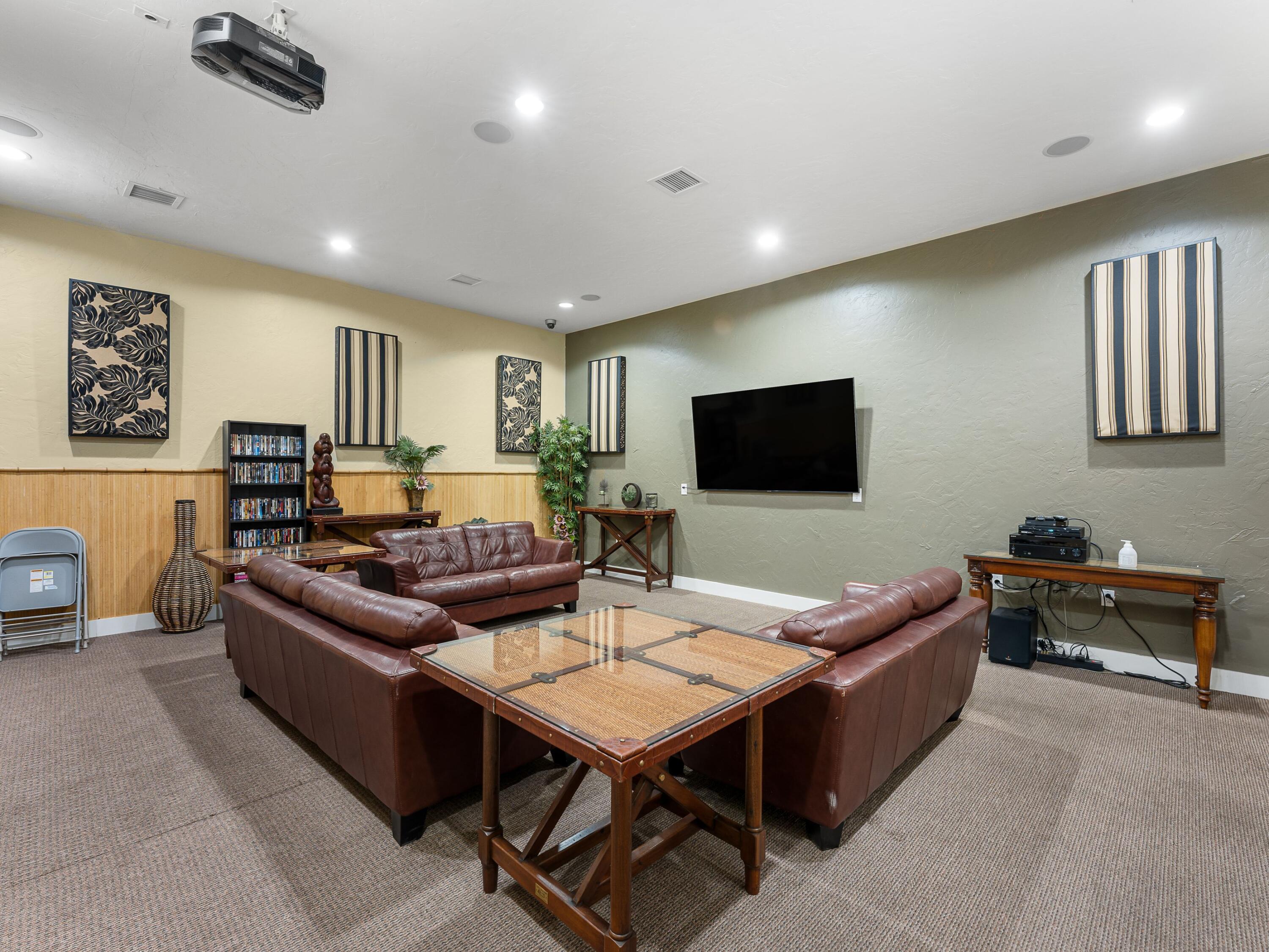 8700 Front Beach Road, Unit 7107 Panama City Beach, FL 32407 - Photo 52 of 54 a living room with furniture and a flat screen tv
