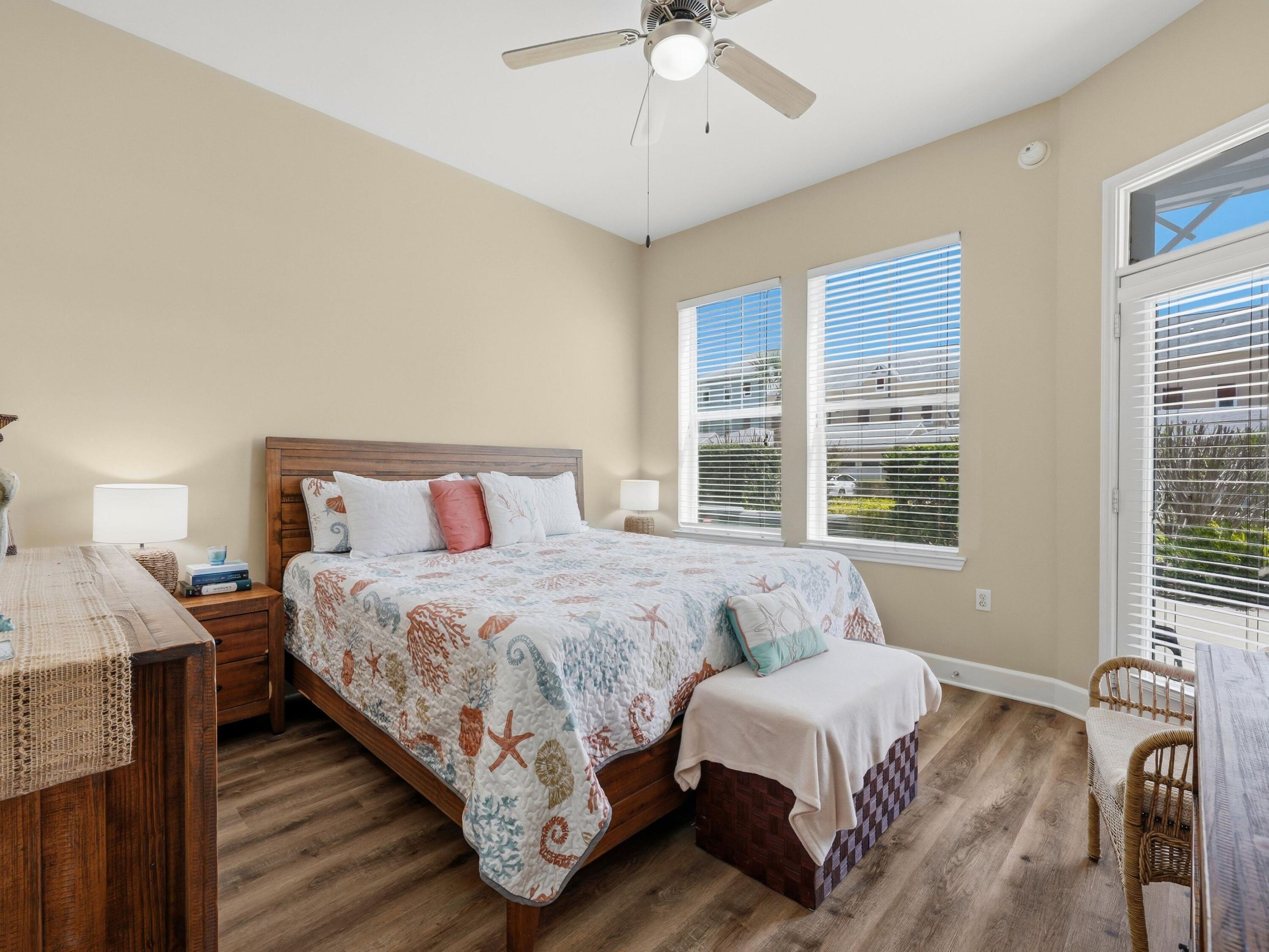 8700 Front Beach Road, Unit 7107 Panama City Beach, FL 32407 - Photo 7 of 54 a bedroom with a bed and large window