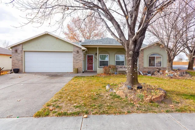 a front view of house with yard covered in front of house