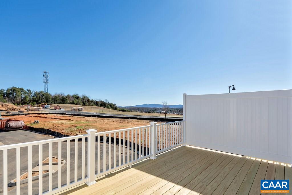 2172 Avinity Loop Charlottesville, VA 22902 - Photo 12 of 19 a view of balcony with wooden floor and fence