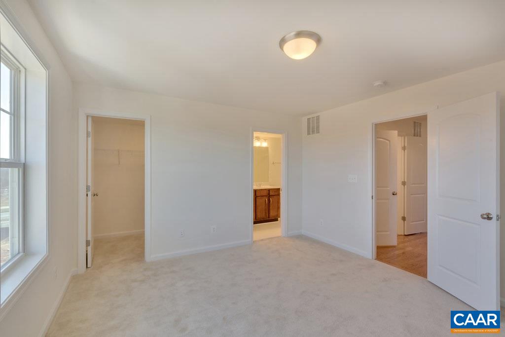 2172 Avinity Loop Charlottesville, VA 22902 - Photo 13 of 19 a view of an empty room with window and bathroom