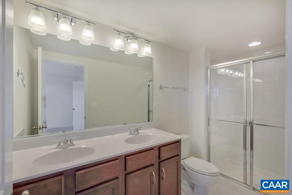 2172 Avinity Loop Charlottesville, VA 22902 - Photo 14 of 19 a bathroom with a sink toilet and a mirror