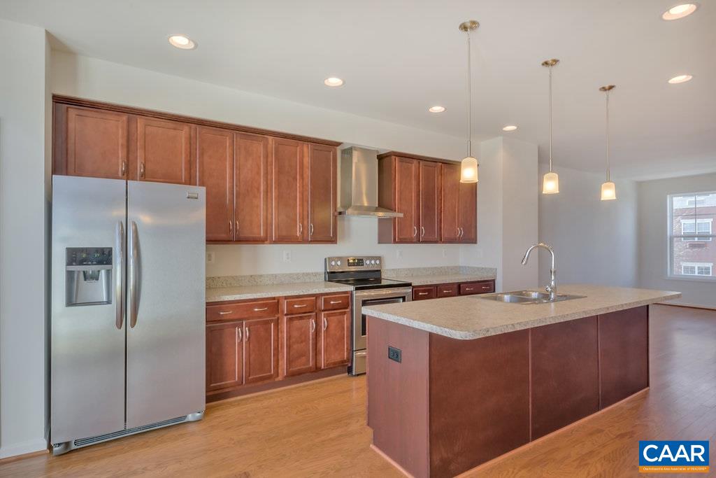 2172 Avinity Loop Charlottesville, VA 22902 - Photo 4 of 19 a kitchen with stainless steel appliances granite countertop a sink a stove a refrigerator and cabinets