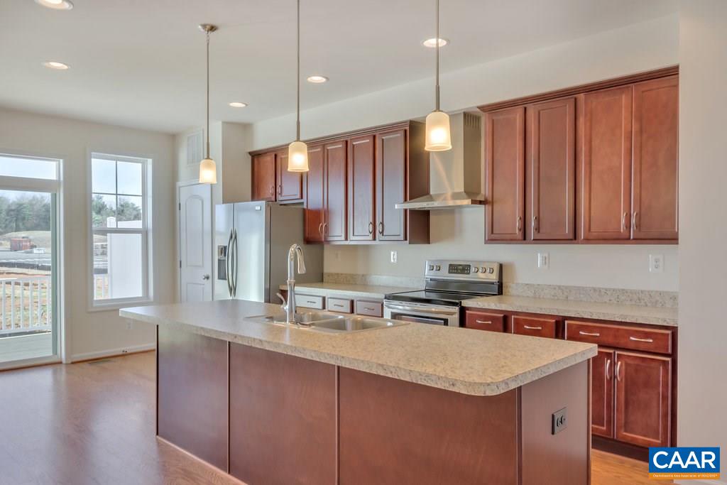 2172 Avinity Loop Charlottesville, VA 22902 - Photo 5 of 19 a kitchen with stainless steel appliances granite countertop a sink a stove and a refrigerator