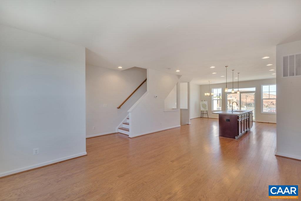 2172 Avinity Loop Charlottesville, VA 22902 - Photo 9 of 19 an empty room with wooden floor and windows