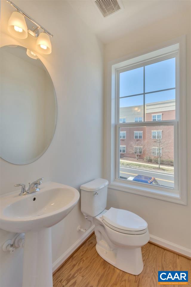 2172 Avinity Loop Charlottesville, VA 22902 - Photo 10 of 19 a bathroom with a toilet a sink and mirror