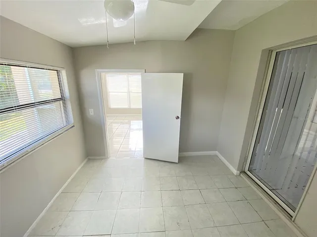 a view of an empty room with a window