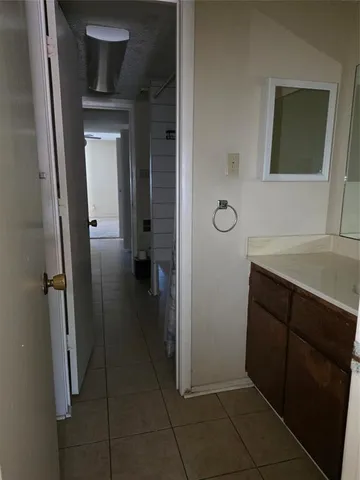 a kitchen with a sink microwave and refrigerator