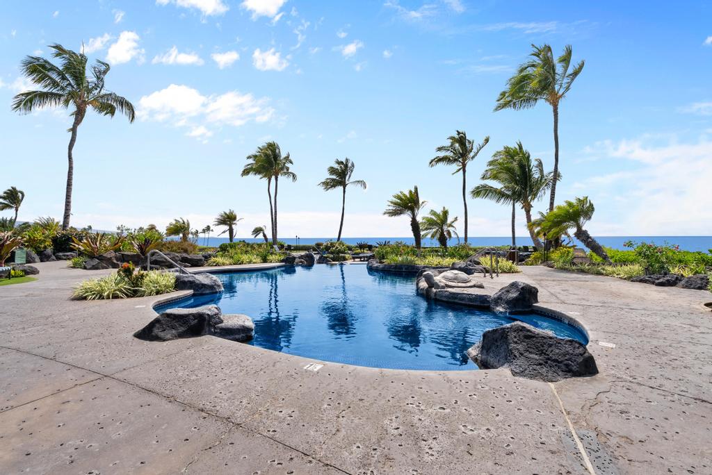 a view of swimming pool with outdoor seating