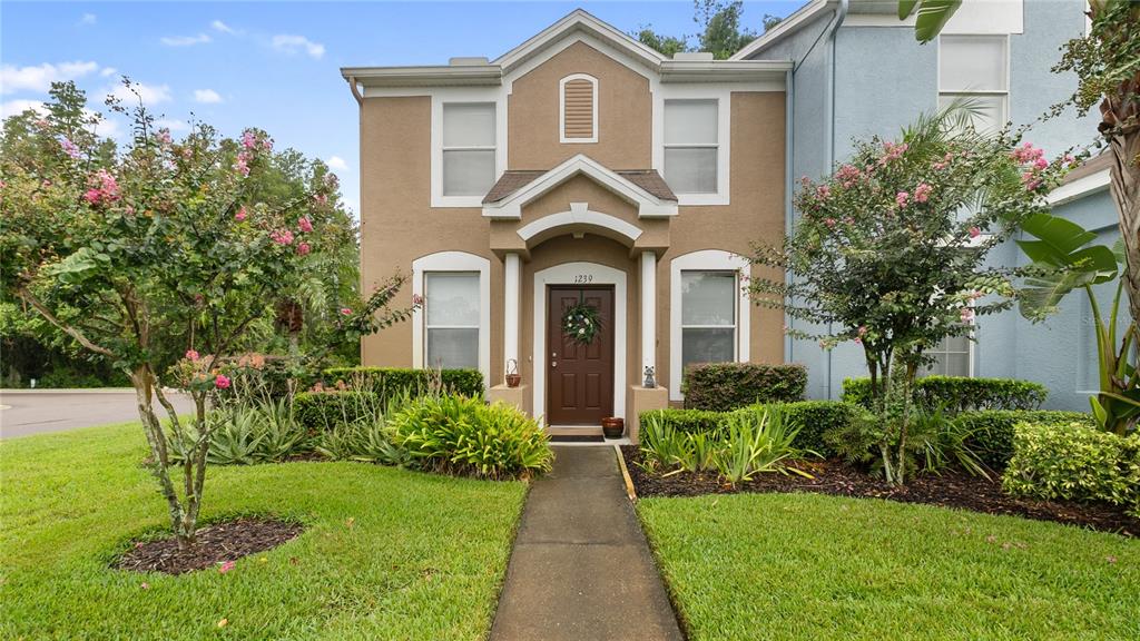 1239 Beckenham Way Wesley Chapel, FL 33543 - Photo 1 of 1 a front view of a house with a yard
