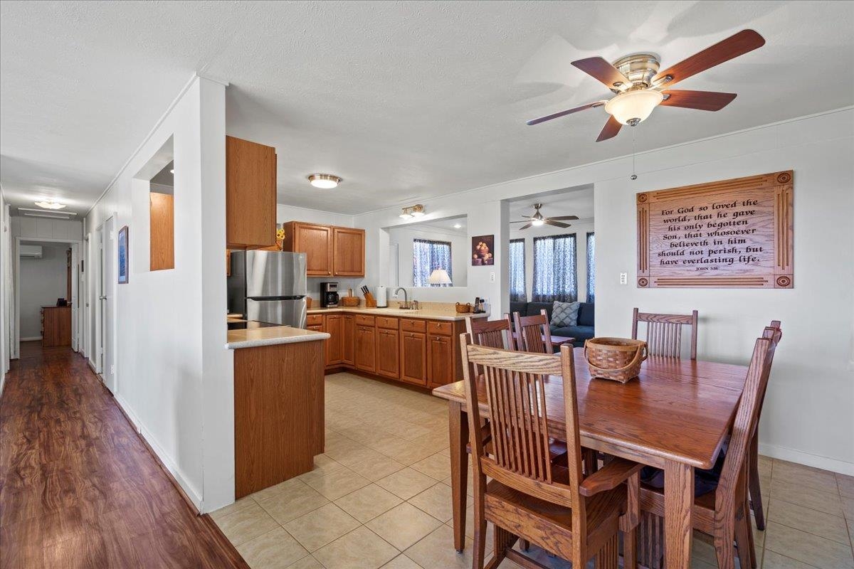 110 Kahiapo Place Haiku, HI 96708 - Photo 12 of 36 a view of a dining room with furniture and wooden floor