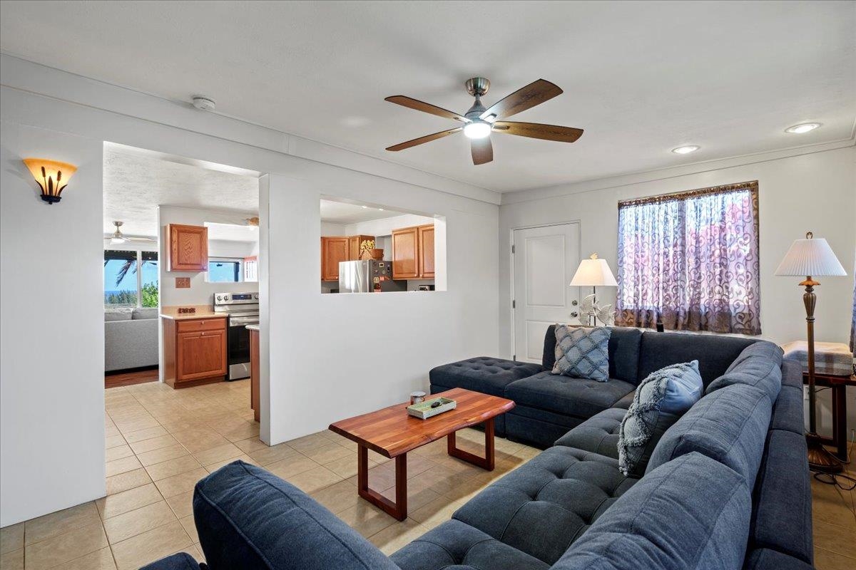 110 Kahiapo Place Haiku, HI 96708 - Photo 13 of 36 a living room with furniture a ceiling fan and a window