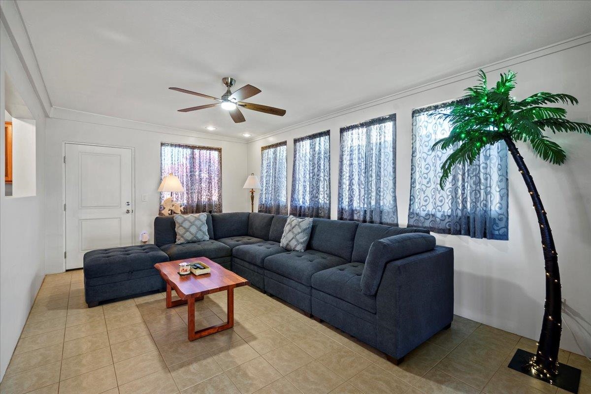 110 Kahiapo Place Haiku, HI 96708 - Photo 15 of 36 a living room with furniture and a potted plant