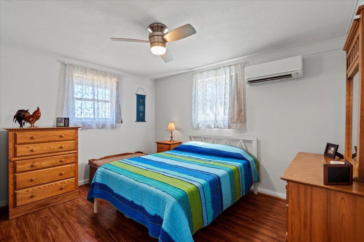 110 Kahiapo Place Haiku, HI 96708 - Photo 19 of 36 a bedroom with a bed and a dresser