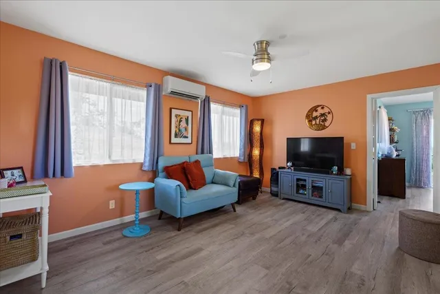 a bedroom with a bed and a view of balcony