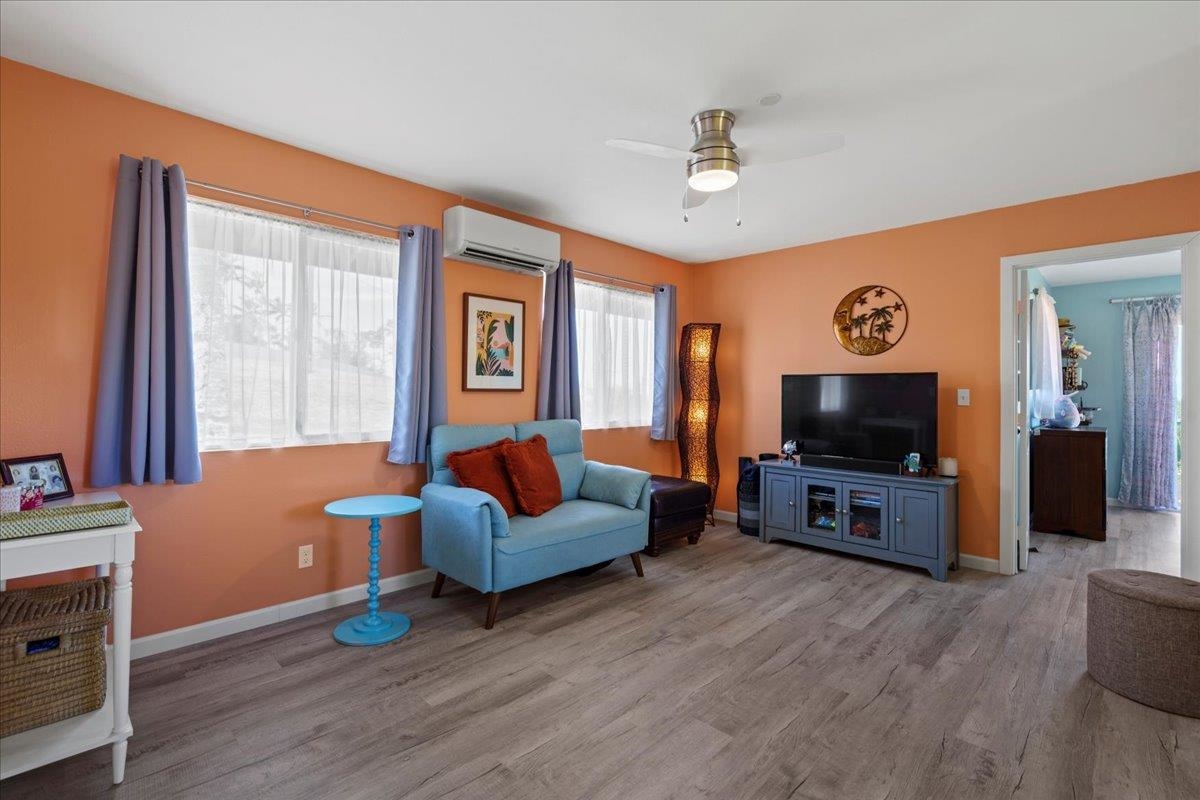110 Kahiapo Place Haiku, HI 96708 - Photo 26 of 36 a living room with furniture and a flat screen tv