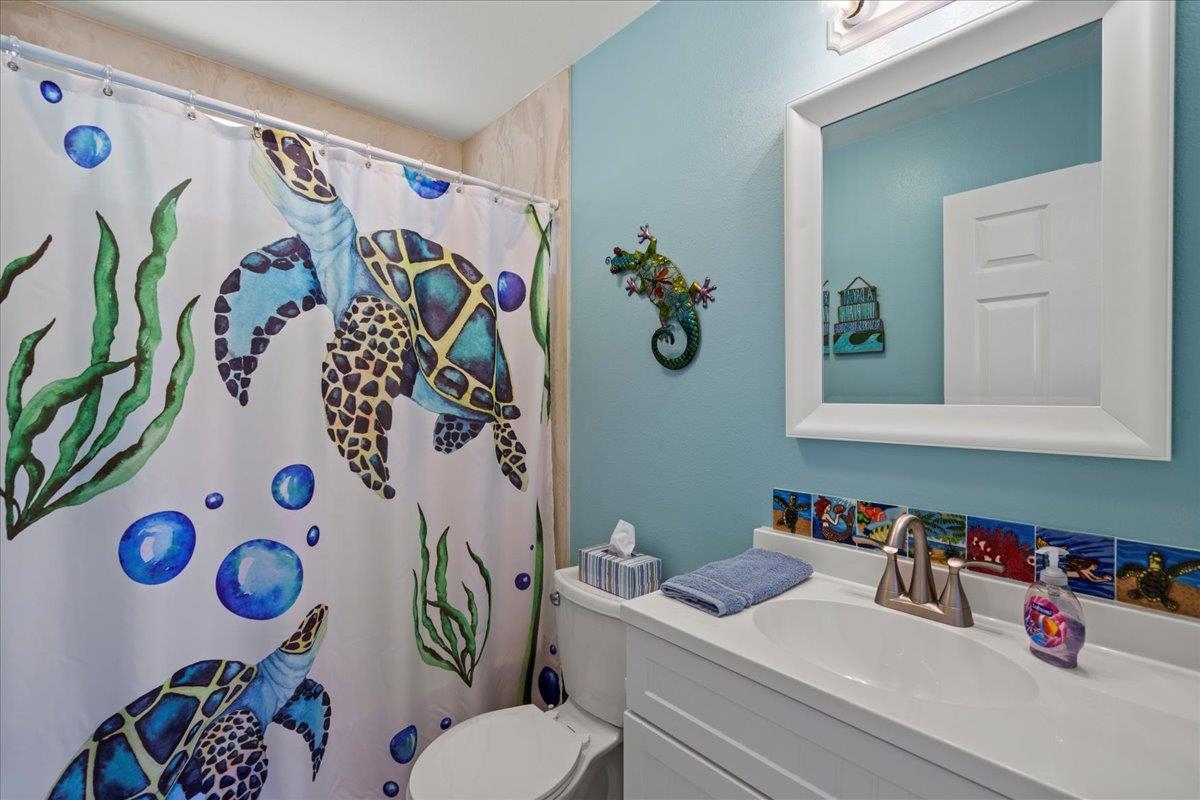 110 Kahiapo Place Haiku, HI 96708 - Photo 30 of 36 a bathroom with a sink mirror and toilet
