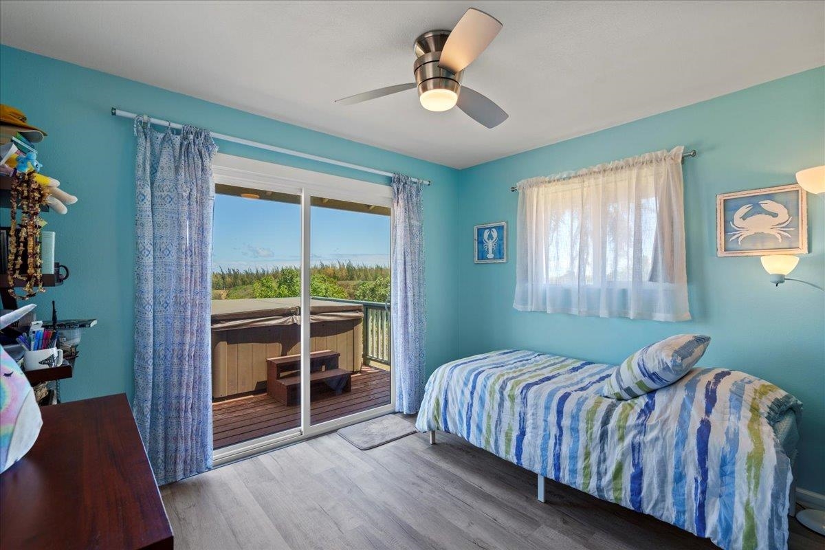 110 Kahiapo Place Haiku, HI 96708 - Photo 32 of 36 a bedroom with a bed and a view of balcony
