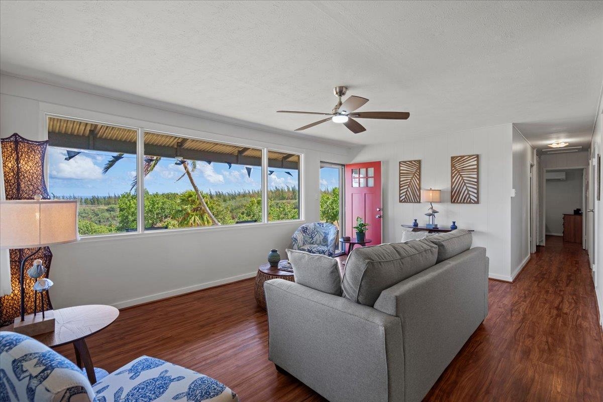 110 Kahiapo Place Haiku, HI 96708 - Photo 6 of 36 a living room with furniture and a large window
