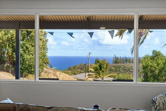 a kitchen with stainless steel appliances granite countertop a sink stove microwave and refrigerator