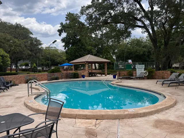 a view of swimming pool with seating space