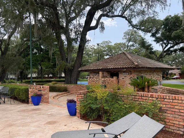 a backyard of a house with yard fire pit and outdoor seating