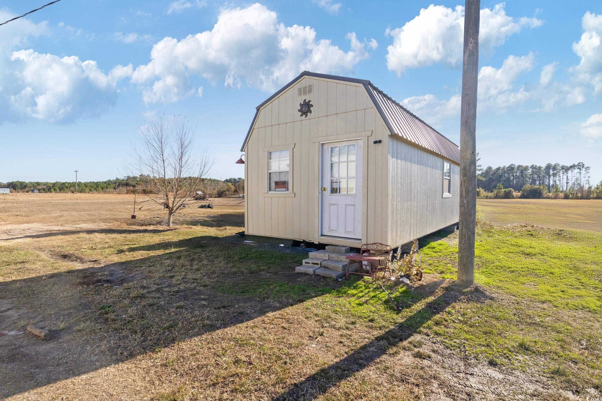 6469 Norton Road Green Sea, SC 29545 - Photo 18 of 25 View of outbuilding with a yard and a rural view