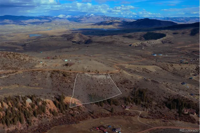 a view of a backyard with wooden fence
