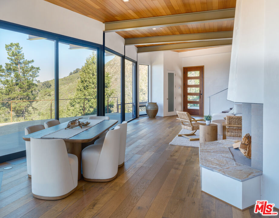 47730 Coast Ridge Road Big Sur, CA 93920 - Photo 12 of 37 a living room with large window and furniture