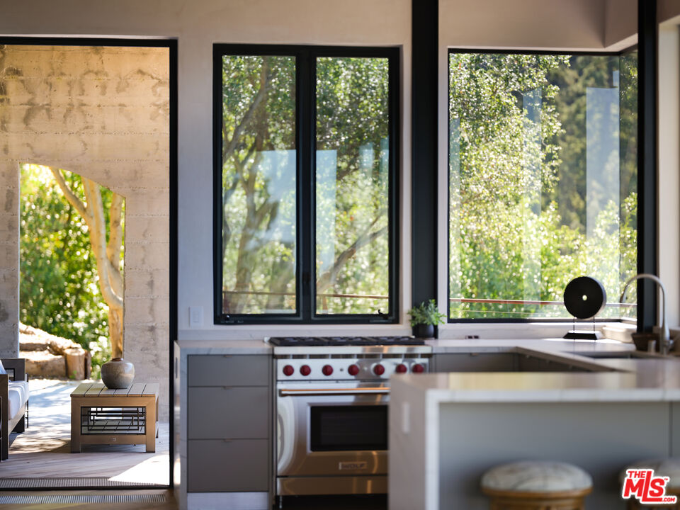 47730 Coast Ridge Road Big Sur, CA 93920 - Photo 14 of 37 a view of a sink and a kitchen with a window