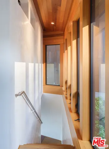 a view of a hallway with windows