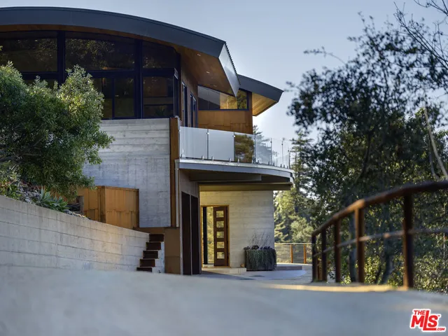 a view of a house with a tree