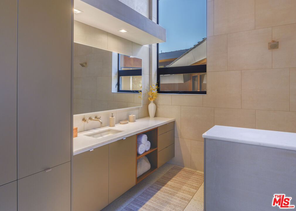 47730 Coast Ridge Road Big Sur, CA 93920 - Photo 27 of 37 a bathroom with a sink and a mirror