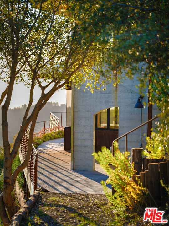 47730 Coast Ridge Road Big Sur, CA 93920 - Photo 30 of 37 a front view of a house with a yard