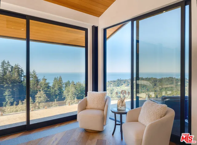 a living room with couch and a window