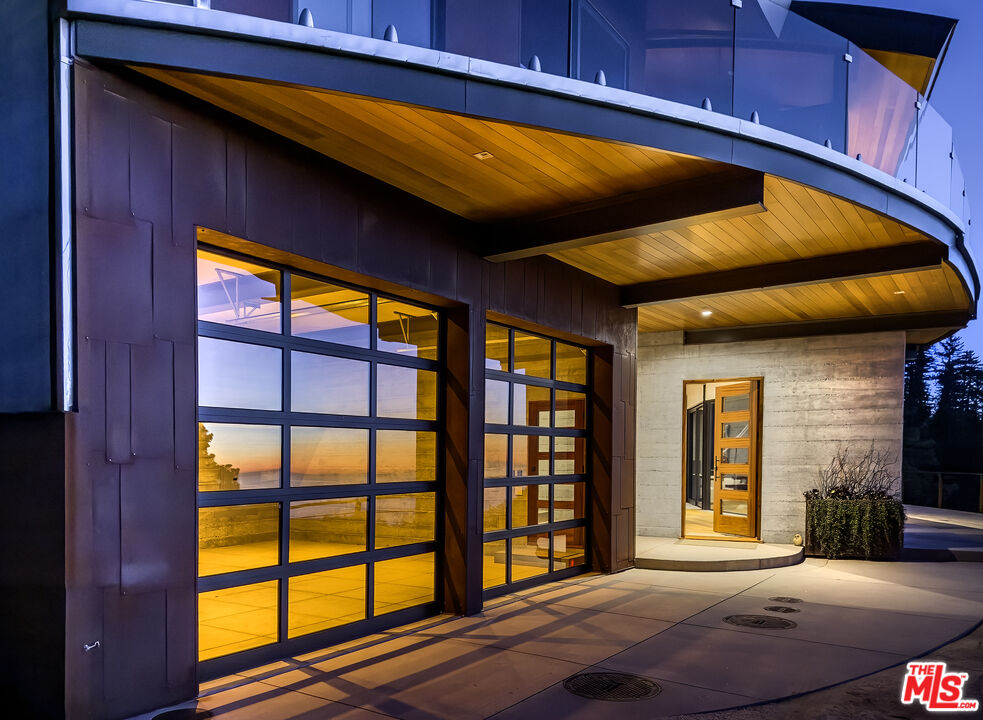 47730 Coast Ridge Road Big Sur, CA 93920 - Photo 34 of 37 a view of a porch with furniture and front door