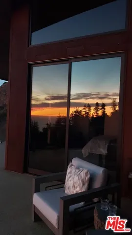 a view of a balcony with chairs