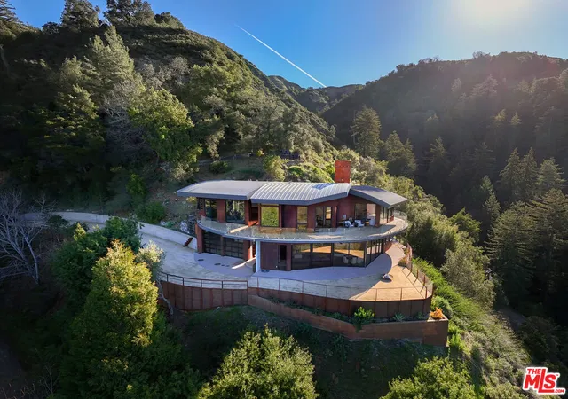 an aerial view of a house with a garden