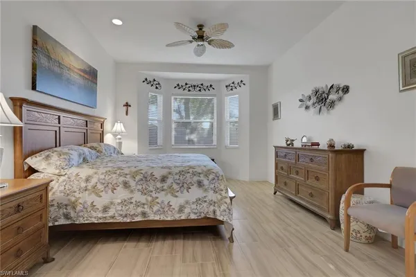 a bedroom with a bed and dresser